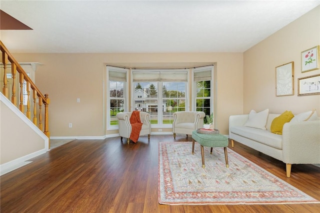 65 Geraldine Pkwy, Gates, NY 14624 - living room with stairway, wood finished floors, and baseboards