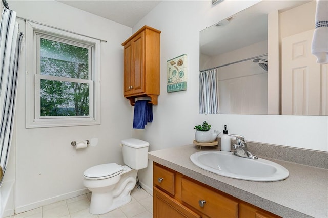 65 Geraldine Pkwy, Gates, NY 14624 - bathroom featuring vanity, baseboards, tile patterned floors, and toilet