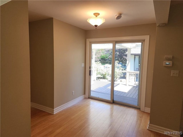 6731 Chestnut Ridge Rd, Orchard Park, NY 14127 - doorway featuring baseboards and light wood-style flooring