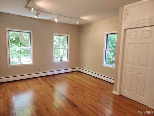 6731 Chestnut Ridge Rd, Orchard Park, NY 14127 - spare room with track lighting, hardwood / wood-style floors, and healthy amount of natural light