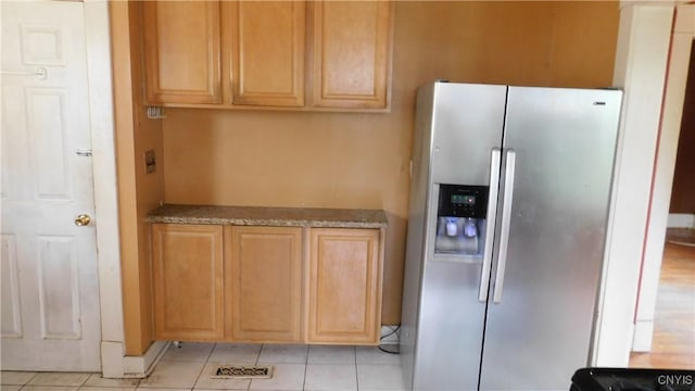 409 E Bloomfield St, Rome-Inside, NY 13440 - kitchen with stainless steel fridge with ice dispenser and light tile patterned flooring