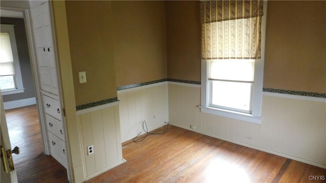 409 E Bloomfield St, Rome-Inside, NY 13440 - empty room with a wainscoted wall and wood finished floors