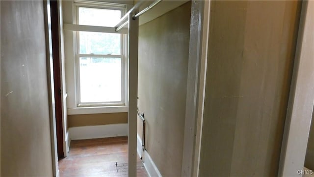 409 E Bloomfield St, Rome-Inside, NY 13440 - hall featuring wood finished floors and baseboards