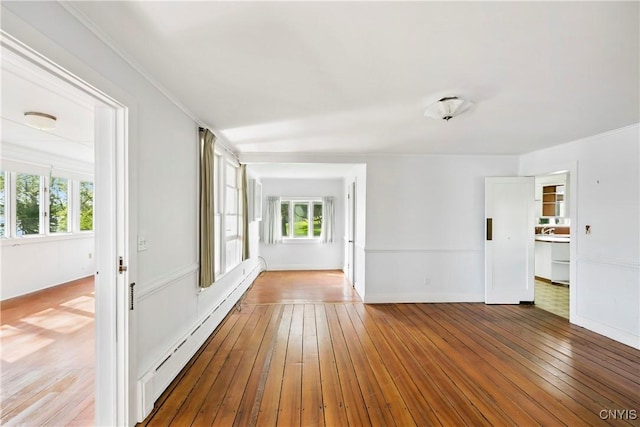 5199 W Lake Rd, Fleming, NY 13021 - spare room with baseboard heating, healthy amount of natural light, hardwood / wood-style flooring, and baseboards