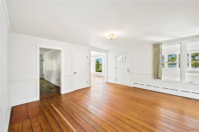 5199 W Lake Rd, Fleming, NY 13021 - unfurnished room with wood-type flooring, a baseboard radiator, and crown molding