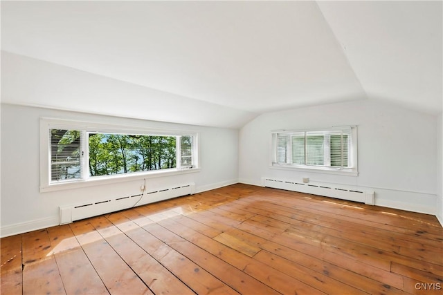 5199 W Lake Rd, Fleming, NY 13021 - additional living space featuring baseboard heating, vaulted ceiling, light wood-type flooring, and baseboards
