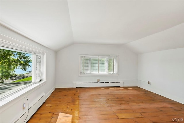 5199 W Lake Rd, Fleming, NY 13021 - bonus room with baseboard heating, vaulted ceiling, healthy amount of natural light, and light wood finished floors