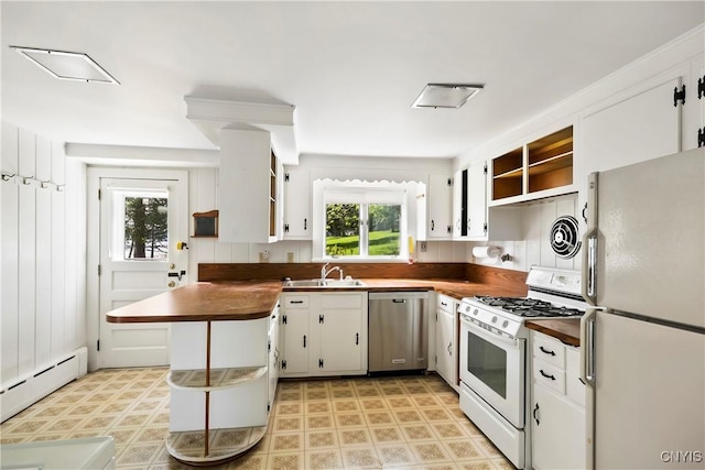 5199 W Lake Rd, Fleming, NY 13021 - kitchen with white appliances, open shelves, a baseboard radiator, a sink, and plenty of natural light