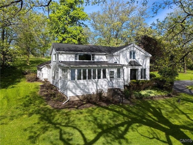 5199 W Lake Rd, Fleming, NY 13021 - view of front of house featuring a front lawn and a sunroom