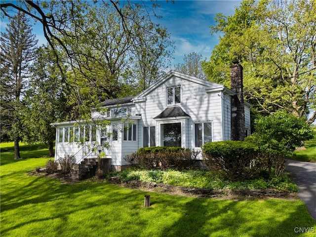 5199 W Lake Rd, Fleming, NY 13021 - traditional home featuring a chimney and a front lawn