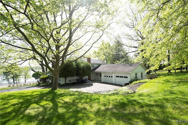 5199 W Lake Rd, Fleming, NY 13021 - view of front of property featuring a front yard and a garage