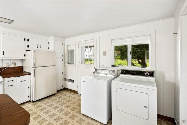 5199 W Lake Rd, Fleming, NY 13021 - laundry area featuring independent washer and dryer, radiator heating unit, and light floors