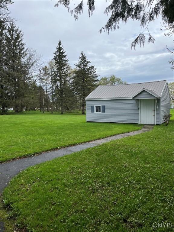 7 Roberts St, Adams, NY 13605 - view of grassy yard with an outdoor structure