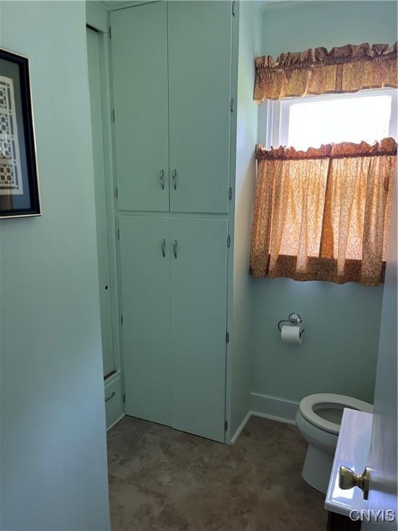 7 Roberts St, Adams, NY 13605 - bathroom featuring toilet, a closet, and baseboards