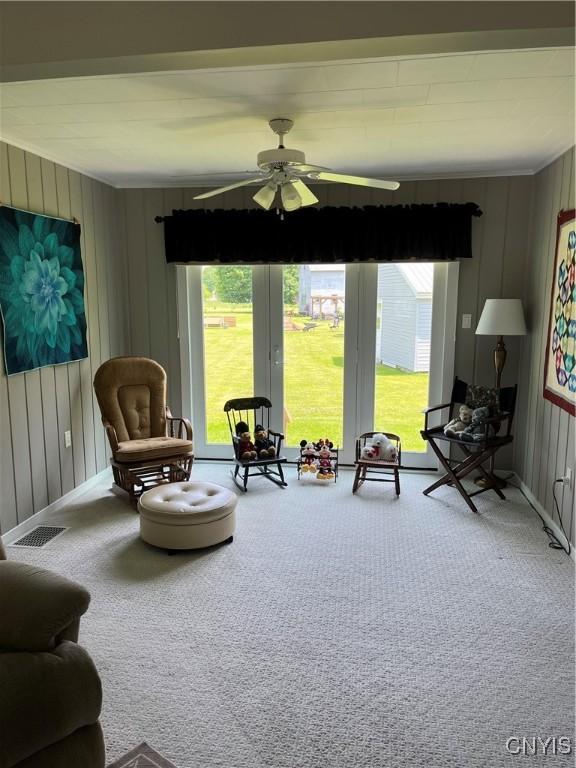7 Roberts St, Adams, NY 13605 - carpeted living area with a ceiling fan