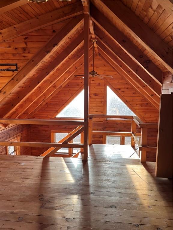 3709 Dean Rd, Hector, NY 14869 - additional living space with wooden walls, wood ceiling, wood-type flooring, and a ceiling fan