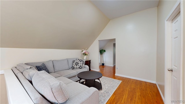 239 Keystone St, Buffalo, NY 14211 - living area with lofted ceiling, baseboards, and light wood-type flooring