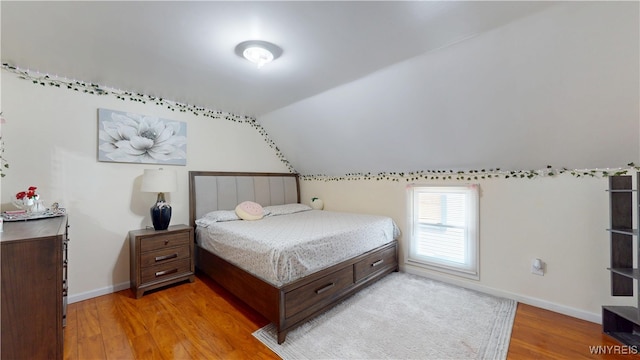 239 Keystone St, Buffalo, NY 14211 - bedroom with light wood-type flooring, lofted ceiling, and baseboards