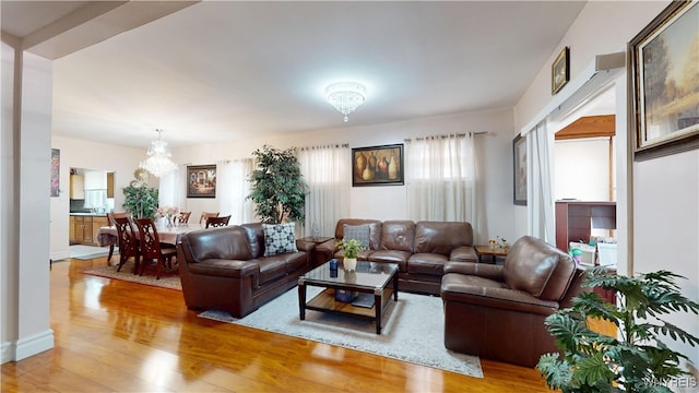 239 Keystone St, Buffalo, NY 14211 - living area with wood finished floors and a chandelier