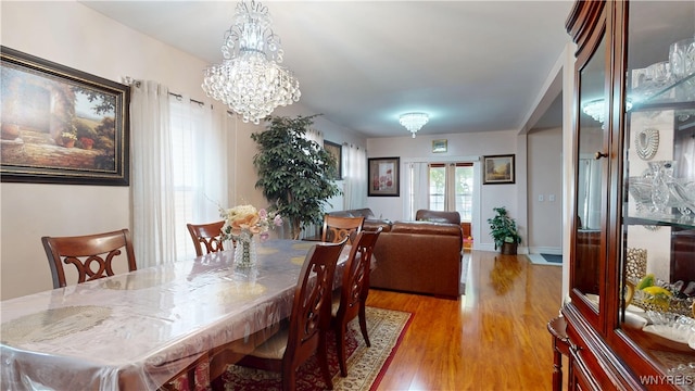 239 Keystone St, Buffalo, NY 14211 - dining area with wood finished floors and a chandelier