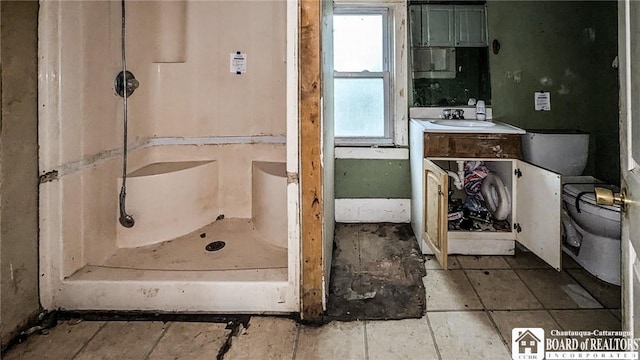 380 Ontario St, Lockport-City, NY 14094 - bathroom featuring toilet, vanity, and a shower