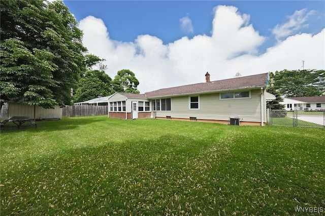1104 98th St, Niagara Falls, NY 14304 - rear view of property featuring a sunroom, central AC, and a chimney