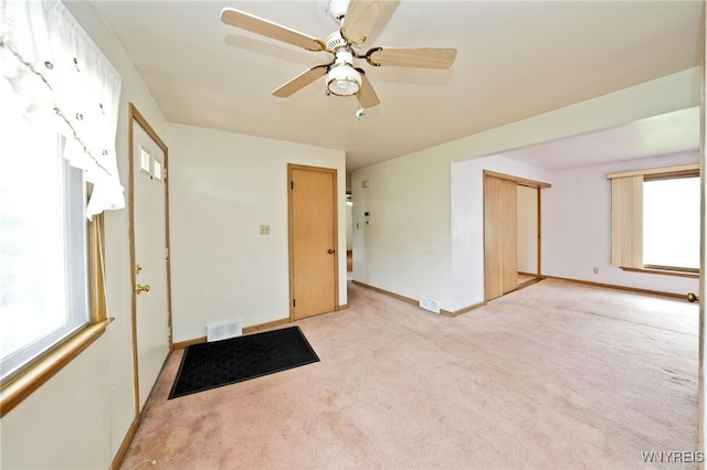 1104 98th St, Niagara Falls, NY 14304 - unfurnished room with light carpet, baseboards, and ceiling fan