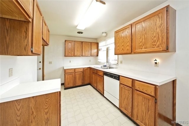 1104 98th St, Niagara Falls, NY 14304 - kitchen featuring white dishwasher, a sink, brown cabinets, and light countertops
