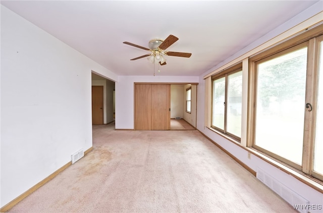 1104 98th St, Niagara Falls, NY 14304 - unfurnished room featuring light colored carpet, a ceiling fan, and baseboards