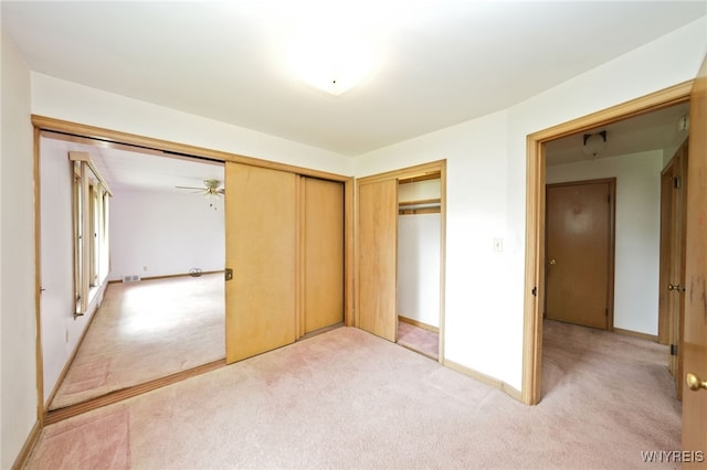 1104 98th St, Niagara Falls, NY 14304 - unfurnished bedroom featuring light carpet, baseboards, and a closet