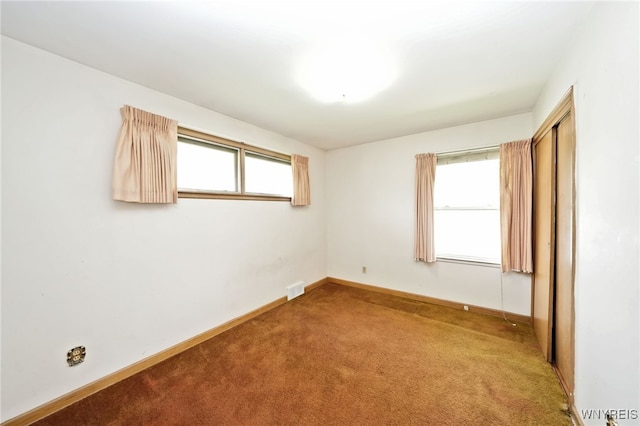 1104 98th St, Niagara Falls, NY 14304 - empty room with carpet and baseboards