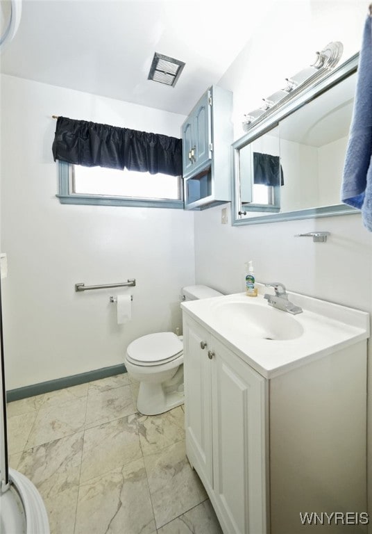 1104 98th St, Niagara Falls, NY 14304 - bathroom with vanity, marble finish flooring, toilet, and baseboards
