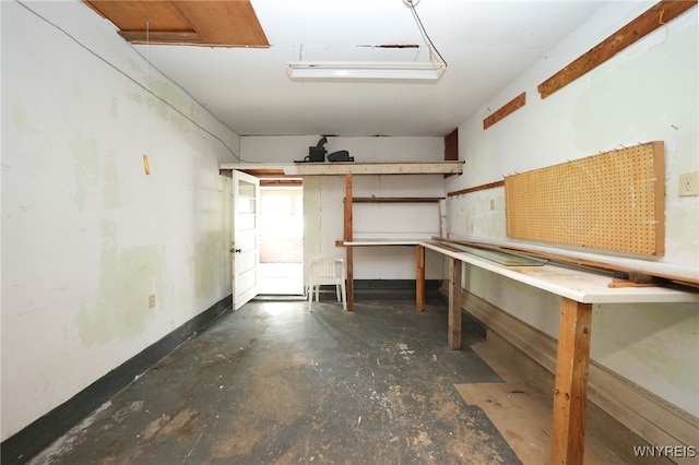 1104 98th St, Niagara Falls, NY 14304 - garage with a workshop area and baseboards