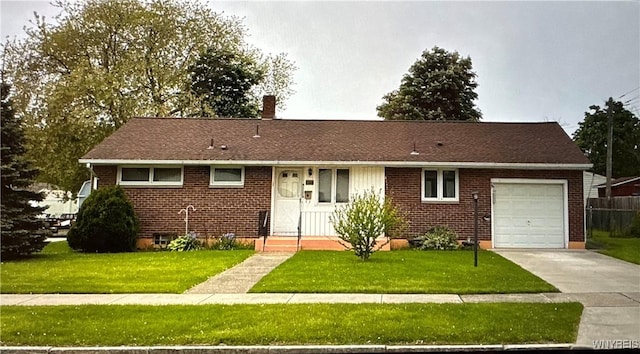 1104 98th St, Niagara Falls, NY 14304 - view of front facade with a garage, concrete driveway, a front yard, and brick siding