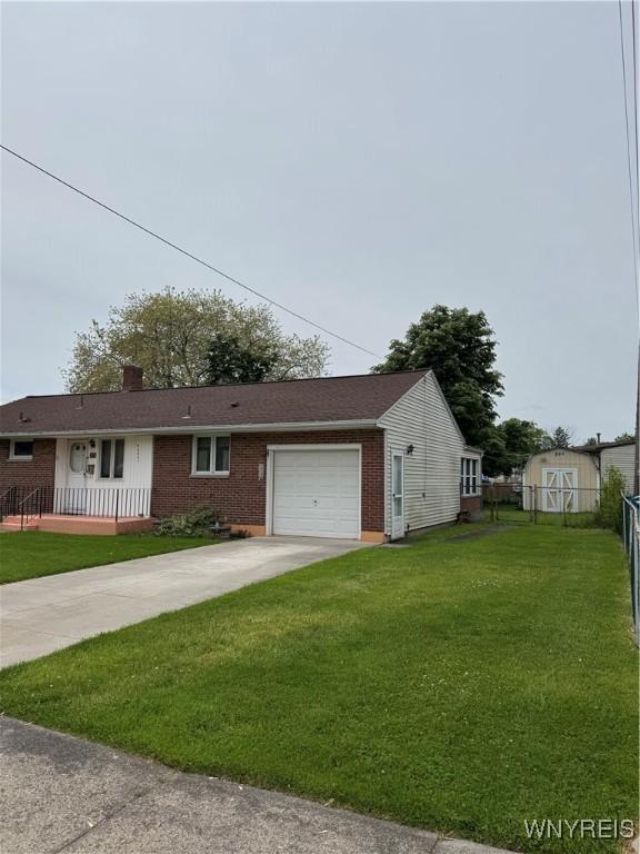 1104 98th St, Niagara Falls, NY 14304 - view of front of house featuring brick siding, driveway, an attached garage, and a chimney