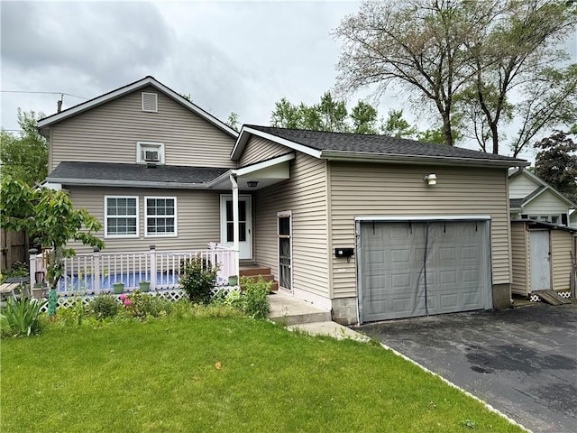 77 Mosley Rd, Greece, NY 14616 - view of front of home featuring an attached garage, driveway, and a front lawn