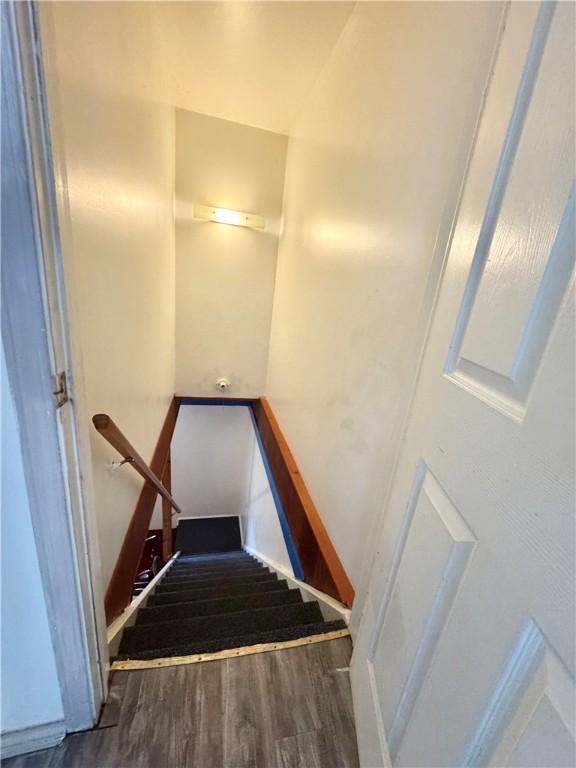 77 Mosley Rd, Greece, NY 14616 - stairs featuring wood finished floors