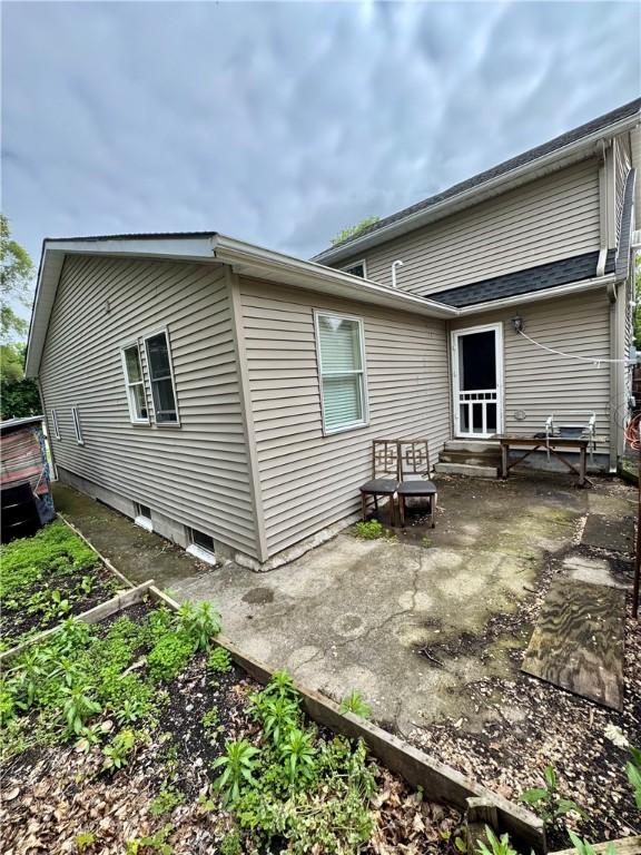 77 Mosley Rd, Greece, NY 14616 - back of property with a patio