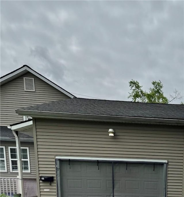 77 Mosley Rd, Greece, NY 14616 - exterior view of a downspout, roof with shingles, and gutters
