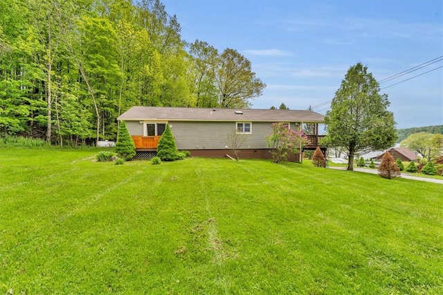 2556 County Highway 22, Richfield, NY 13439 - back of property featuring a wooden deck and a yard