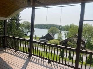 2556 County Highway 22, Richfield, NY 13439 - wooden terrace featuring a water view