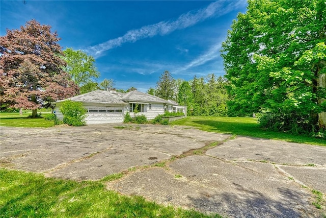 492 Drumm Rd, Webster, NY 14580 - view of front of house with a garage, a front yard, and concrete driveway