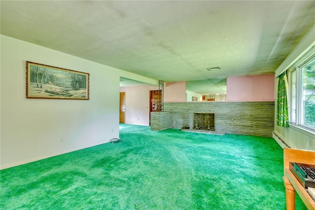 492 Drumm Rd, Webster, NY 14580 - unfurnished living room featuring carpet flooring, baseboard heating, and a fireplace with raised hearth