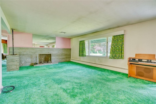 492 Drumm Rd, Webster, NY 14580 - unfurnished living room with a fireplace with raised hearth, a baseboard radiator, and carpet flooring
