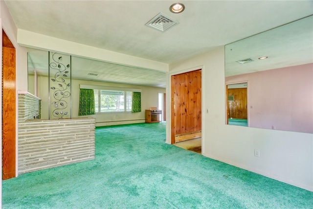 492 Drumm Rd, Webster, NY 14580 - unfurnished living room featuring a baseboard heating unit, baseboard heating, carpet flooring, baseboards, and recessed lighting