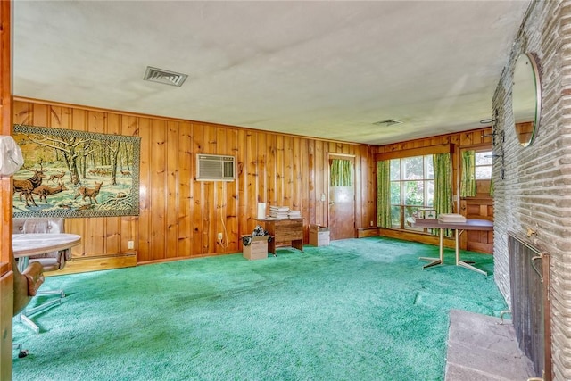 492 Drumm Rd, Webster, NY 14580 - sitting room featuring carpet floors, an AC wall unit, a brick fireplace, and wood walls