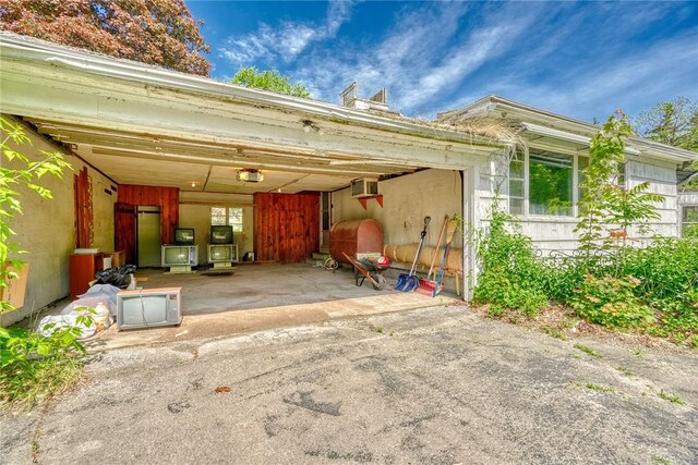 492 Drumm Rd, Webster, NY 14580 - view of car parking featuring oil tank, a garage, and driveway