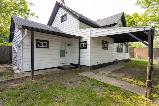 225 Wilder St, Rochester, NY 14611 - rear view of house with a chimney and a shingled roof