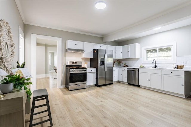 225 Wilder St, Rochester, NY 14611 - kitchen with appliances with stainless steel finishes, a sink, white cabinets, light countertops, and crown molding