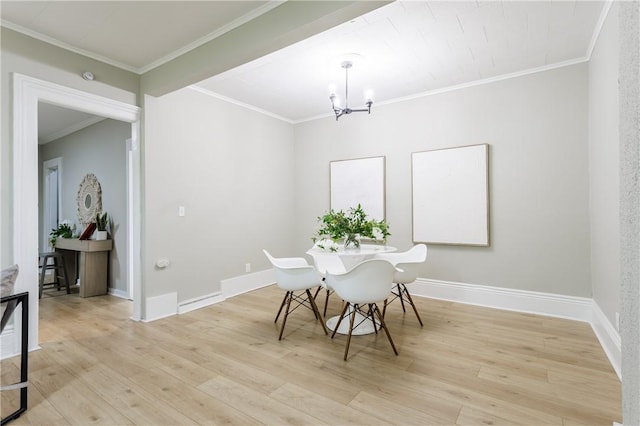 225 Wilder St, Rochester, NY 14611 - dining space with a chandelier, light wood-style floors, ornamental molding, and baseboards